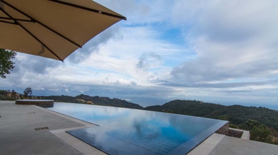 Serenity in nature: infinity pool and hot tub with sweeping mountain vistas Photo