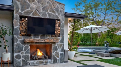 Stylish outdoor kitchen and dining area with a modern aesthetic Photo