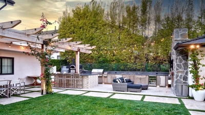 Picturesque outdoor kitchen and dining setup for enjoying meals outdoors Photo