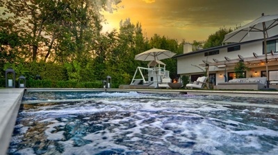 Serene outdoor retreat featuring a modern pool and jacuzzi Photo
