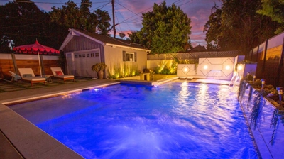 Backyard pool with lights Photo