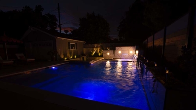 Pool with light on at night time Photo