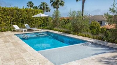 Pool and jacuzzi with built in motorized pool cover Photo