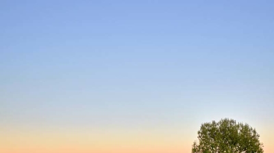 Infinity pool with a mountain view at sunset Photo