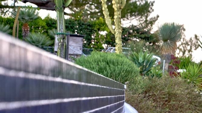 Tiled wall with water fall and basin Photo