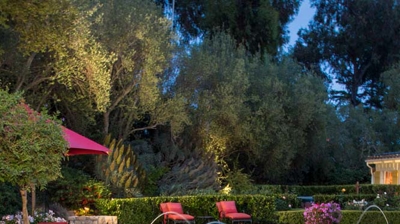 Red brick accents adding warmth to the poolside ambiance Photo