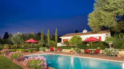 Vibrant flowers adding color to the landscaped pool area Photo