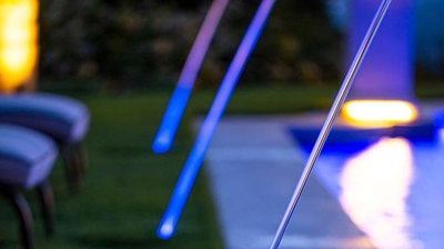 A breathtaking water sanctuary bordered by sprawling lawns and adorned with water features. Photo