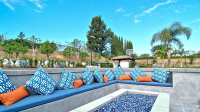 Custom sunken backyard firepit and seating area Photo