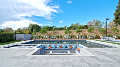 Modern backyard patio design with sunken seating area Photo