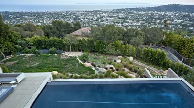Modern infinity pool design with spa and view during the day Photo