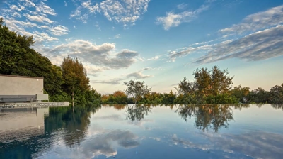 Modern infinity pool design at dusk Photo