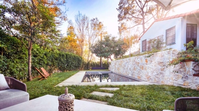 Backyard small custom pool as seen from seating area Photo