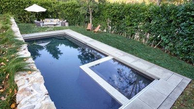 Backyard small custom pool as seen from above Photo