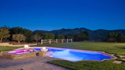 Illuminated pool and spa at night Photo