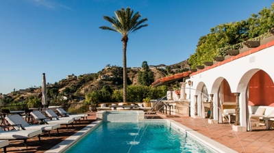 Spanish-influenced architecture with outdoor pool Photo