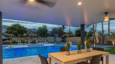 Trendy outdoor retreat boasts sleek pool and spa conversation area. Photo