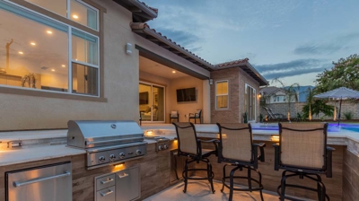 Urban outdoor space features modern pool spa BBQ conversation pit. Photo