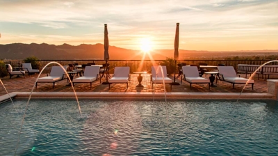 Charming Spanish abode showcasing a grand pool with intricate water elements. Photo