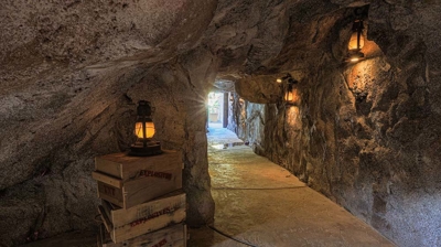 A sanctuary adorned with fossilized treasures in a backyard tunnel. Photo