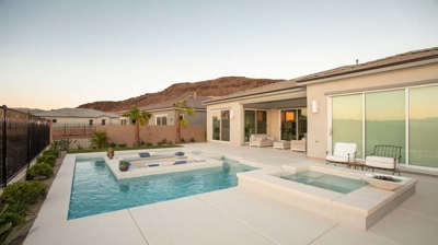 Backyard pool and patio with custom spa Photo