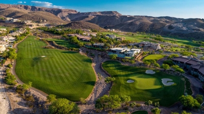 Aerial view of house with pool on golf course Photo