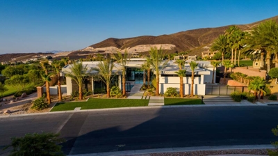 Aerial view of house from street with landscaping Photo