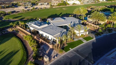 Aerial view of house on golf course and landscaping Photo