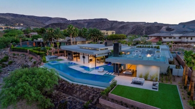 Aerial view of house with pool at sunset Photo