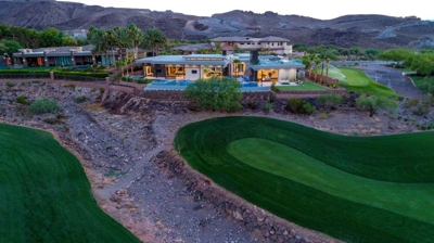 View of house with backyard pool from golf course Photo
