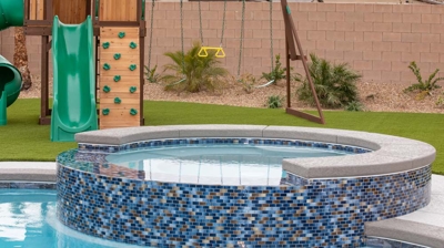 Backyard pool with custom tiled spa Photo
