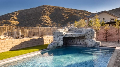 Backyard pool with custom waterfall Photo