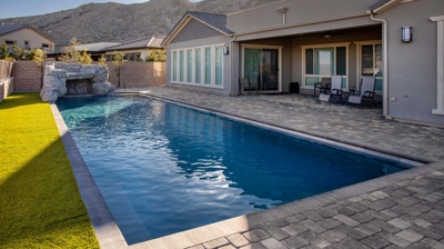Custom pool with stone waterfall Photo