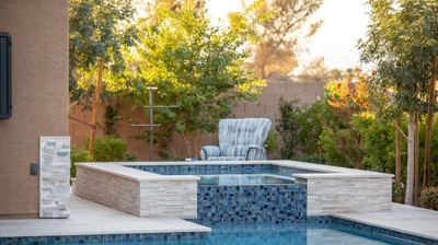 Custom stone spa and pool design Photo