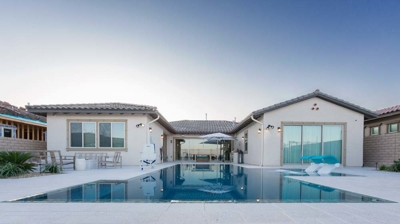 View of house and backyard pool area Photo
