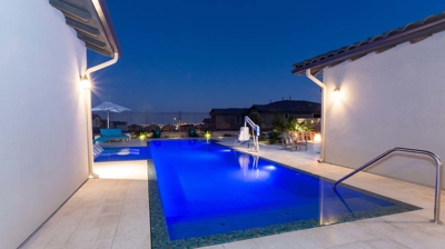 Pool illuminated at night Photo