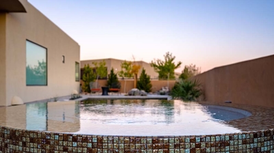 Custom infinity edge spa with tilework Photo