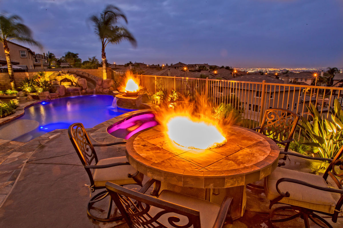 pool next to a fire pit 