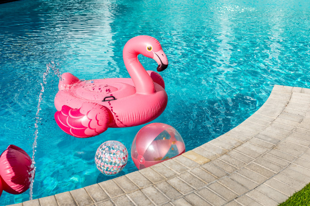 Pool with inflatable flamingo and balls