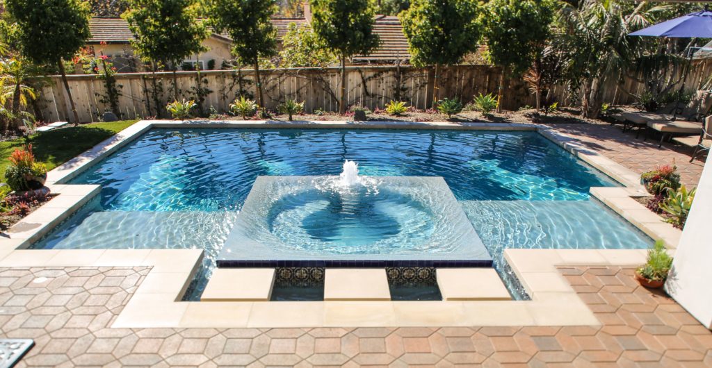 pool with a fountain in the middle