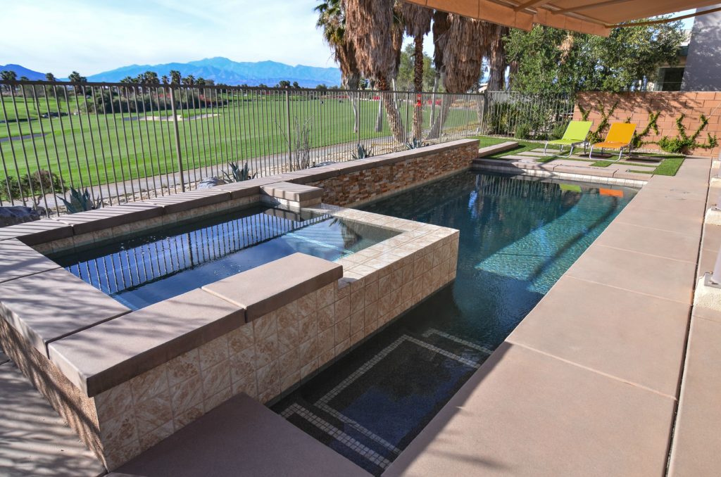 pool with above ground jacuzzi