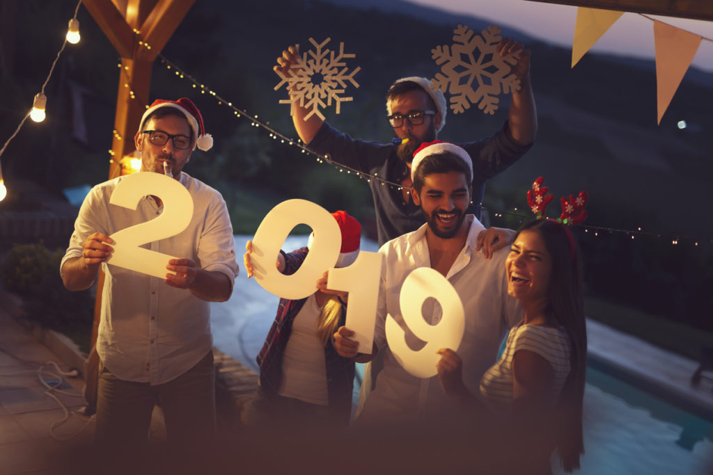 A group of people celebrating New Year of 2019